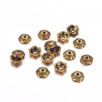 Six Petal Alloy Flower Spacer Beads. Flower Shaped Bead Caps, Gold Color. Flower Spacers for DIY Jewelry Making Projects.   Size: 6mm Diameter, 2mm Thick, Hole: 1mm, approx. 25pcs/package  Material: Alloy Flower Bead Caps. Shinny Antique Gold Color. Lead and Nickel Free.