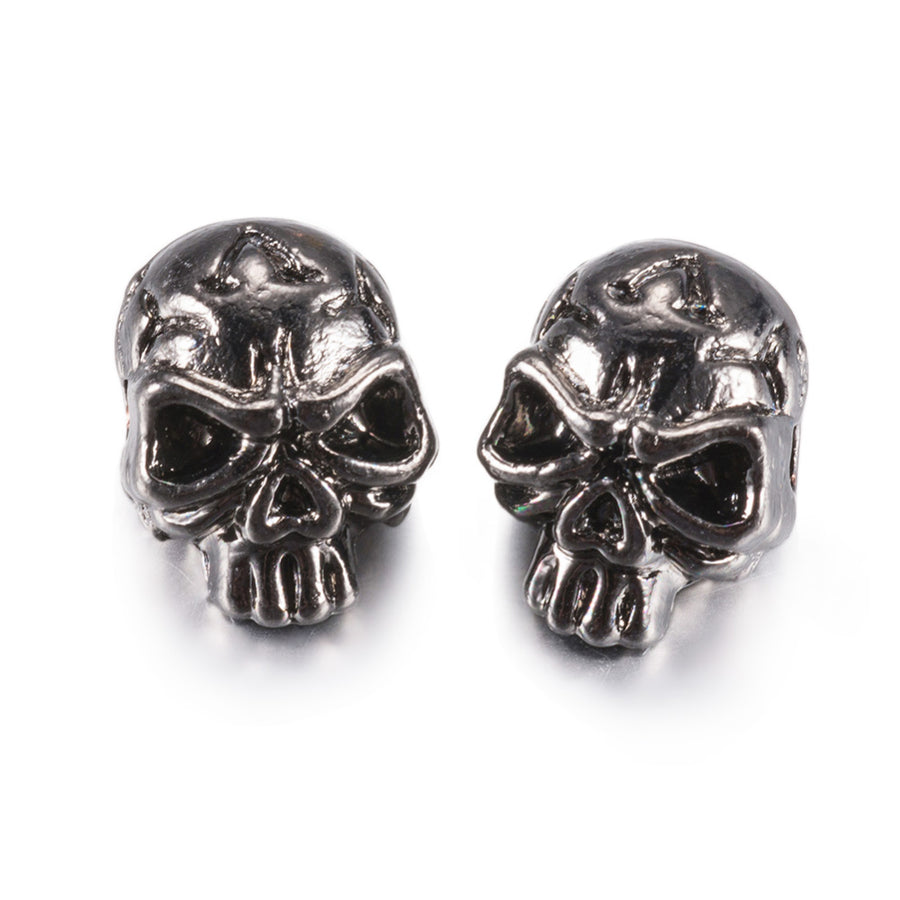 Tibetan Skull Spacer Beads, Gunmetal Color. Skull Shaped Alloy Spacers for DIY Jewelry Making Projects. High Quality Gunmetal Spacers; Perfect for Men's Bracelet Designs. Gunmetal Tibetan Alloy Spacers. Gunmetal Color Plated Skull Shaped Spacer Beads. Polished, Shinny Finish. Lead and Nickel Free.