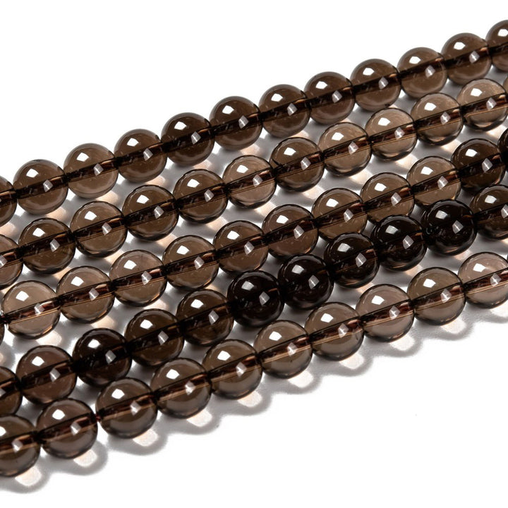 Natural Smoky Quartz Beads, Round, Smoky Brown Color. Semi-Precious Gemstone Beads for DIY Jewelry Making. Gorgeous, High Quality Natural Stone Beads.  Size: 8mm Diameter, Hole: 1mm; approx. 45pcs/strand, 15" Inches Long.  Material: Genuine Smoky Quartz Beads, High Quality, Smoky Brown Color. Polished, Shinny Finish. 