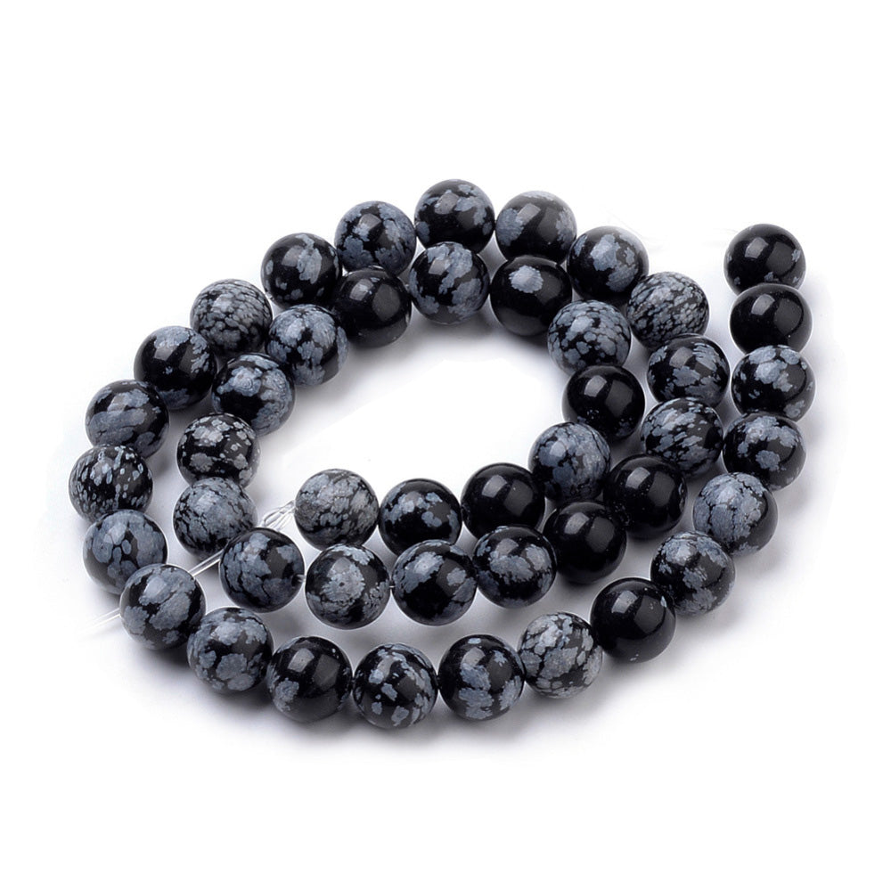 Natural Snowflake Obsidian Beads, Black Color. Semi-precious Gemstone Beads for DIY Jewelry Making.   Size: 8mm Diameter, Hole: 1mm approx. 48pcs/strand, 15 Inches Long.  Material: Premium Grade Genuine Snowflake Obsidian Stone Beads, Black Color. Shinny, Polished Finish. 