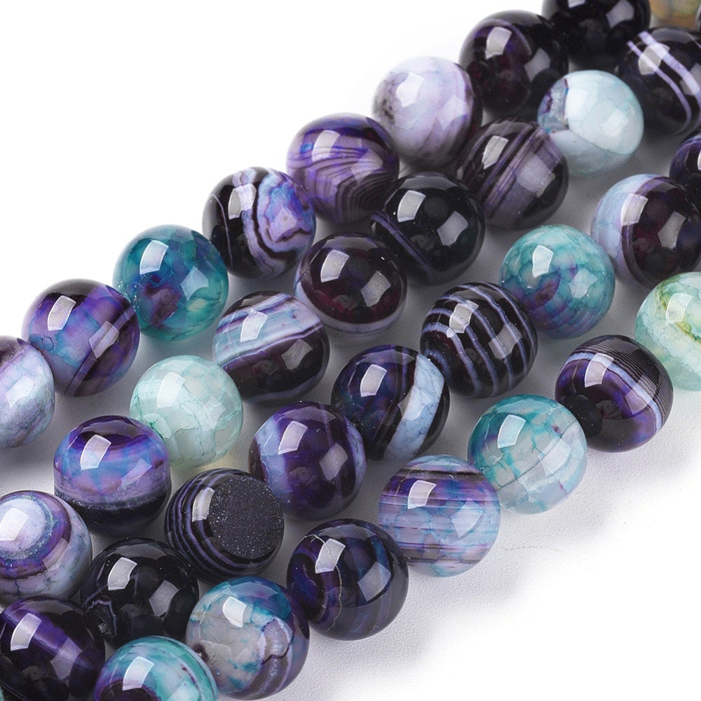 Prussian Blue Striped Agate Beads, Round, Dyed, Blue Banded Agate. Semi-Precious Gemstone Beads for Jewelry Making. Great for Stretch Bracelets and Necklaces.  Size: 10mm Diameter, Hole: 1.2mm; approx. 36pcs/strand, 14.5" Inches Long.  Material: Striped Banded Agate Beads Dyed Purple Blue Color. Polished, Shinny Finish.