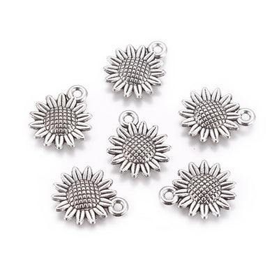Silver Sunflower Charm Beads, Antique Silver Colored Vintage Flower Charms for DIY Jewelry Making. Sunflower Charms for Bracelet and Necklace Making.  Size: 18mm Length, 15mm Width, 2.5mm Thick, Hole: 1.8mm, Quantity: 10 pcs/package.  Material: Alloy (Lead and Nickel Free) Charms. Antique Silver Color. Shinny Finish.