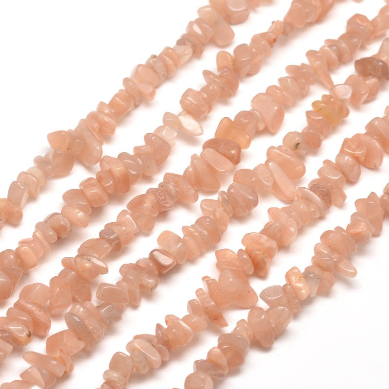 Natural Sunstone Chip Beads. Semi-Precious Stone Chips for Jewelry Making.  Size: 5-8mm width, 5-8mm length, hole: 1mm; approx. 31.5 inches long.  Material: Genuine Sunstone Chip Bead Strands. Polished, Shinny Finish.