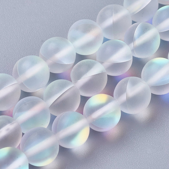 Frosted Synthetic Moonstone Beads, Round, Clear Color. Matte Holographic Beads for DIY Jewelry Making.  Size: 8mm in Diameter, Hole: 1mm, approx. 45-47pcs/strand, 14.5" Inches Long.  Material: Synthetic Frosted Moonstone Beads, Transparent Frosted Clear Color. Holographic Purple Beads. Frosted Matte Finish.