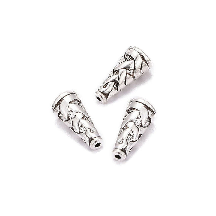 Tibetan Bead Cones, Antique Silver Colored Cones for DIY Jewelry Making. Add the perfect Finishing Touch to Your Jewelry Designs with these Stylish Cones.  Size: 8mm Diameter, 18mm Length, Hole: 1mm, Quantity: 4pcs/bag  Material: Alloy (Lead and Nickel Free) Bead Cone. Antique Silver Color. Shinny Finish.