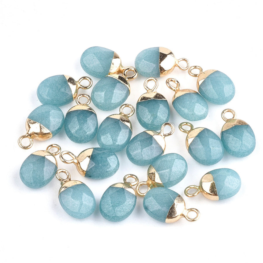 Gorgeous Natural Jade Faceted Oval Charms, Dyed Teal Blue Color. Semi-precious Gemstone Pendant for DIY Jewelry Making. Great as a Charm or Pendant.  Size: 14mm Length, 8mm Wide, 5mm Thick, Hole: 1.8mm, 1pcs/package.  Material: Natural Jade Stone Charms with Gold Plated Iron Loops Findings. High Quality, Faceted Oval Stone Pendants. Shinny, Polished Finish. 