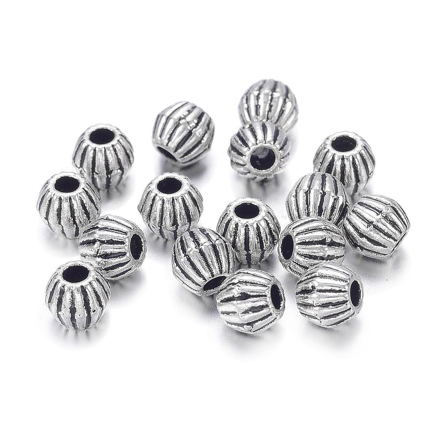 Tibetan Bicone Spacer Beads, Antique Silver Color. Silver Spacers for DIY Jewelry Making Projects. High Quality, Classy, Non-Tarnish Spacers for Beading Projects.  Size: 4.5mm Wide, 4mm Length, Hole: 1mm, approx. 25pcs/bag.   Material:  Antique Silver Tibetan Style, Shinny Finish. Cadmium, Lead and Nickel Free Spacers.