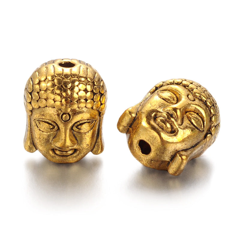 Tibetan Buddha Spacer Beads, Antique Gold Color. Gold Buddha Head Spacers for DIY Jewelry Making Projects. High Quality, Classy, Non-Tarnish Spacers for Beading Projects. Antique Gold Tibetan Style Alloy Buddha Head Spacer Beads. Shinny Finish. 100% Lead and Nickel Free Spacers. www.beadlot.com