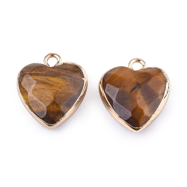 Faceted Tiger Eye Heart Charms, Goldenrod Brown Color with Gold Plated Findings. Semi-precious Gemstone Pendant for DIY Jewelry Making.  Size: 16-17mm Length, 14-15mm Wide, 6-7mm Thick, Hole: 1.8mm, 1pcs/package.   Material: Genuine Natural Tiger Eye Stone Pendant, Gold Toned Findings. Heart Shaped Stone Pendants. Faceted Polished Finish. 