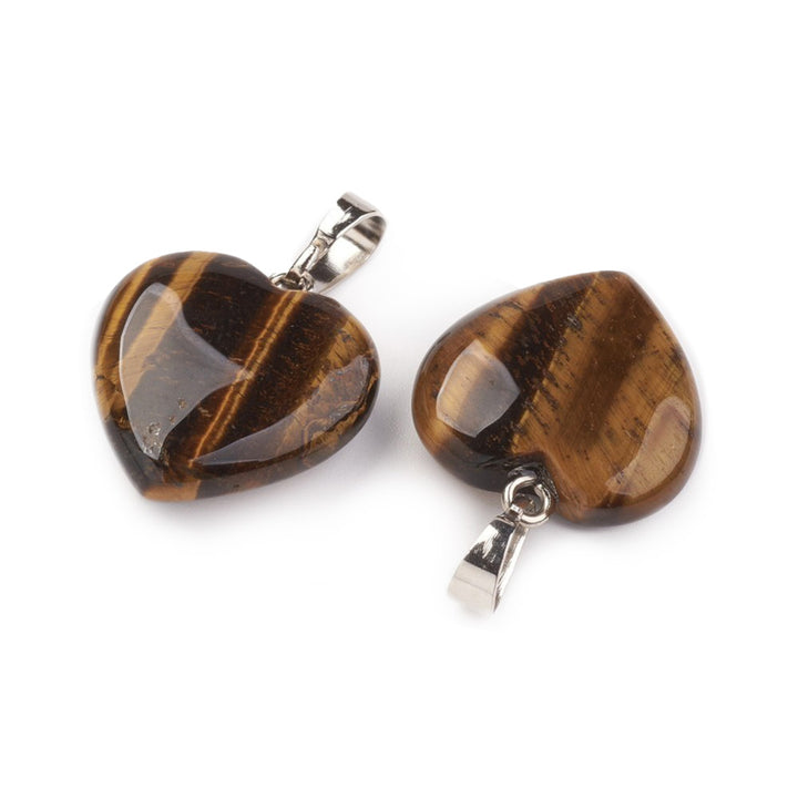 Tiger Eye Heart Pendants, Golden Brown Color with Silver Brass Findings. Semi-precious Gemstone Pendant for DIY Jewelry Making. Gorgeous Centre piece for Necklaces.   Size: 22mm Length, 19mm Wide, 6mm Thick, Hole: 6-7mm, 1pcs/package.   Material: Genuine Natural Tiger Eye Stone Pendant, Platinum Toned Brass Findings. Tigereye Heart Shaped Stone Pendants. Polished Finish.    
