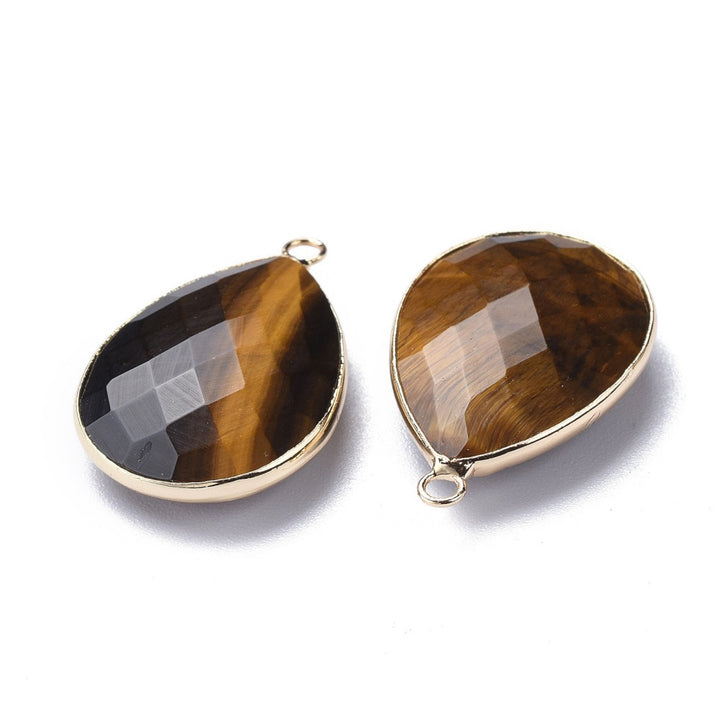 Natural Tiger Eye Faceted Teardrop Gemstone Pendants, Brown Golden Yellow Color. Semi-precious Gemstone Pendant for DIY Jewelry Making. Gorgeous Centre piece for Necklaces.   Size: 28mm Length, 19-20mm Width, 7mm Thick, Hole: 1.2mm, Qty: 1pcs/package.  Material: Genuine Tiger Eye Stone Pendant, Light Gold Plated Brass Findings. Tear Drop Shaped Stone Pendants. Shinny, Polished Finish. 