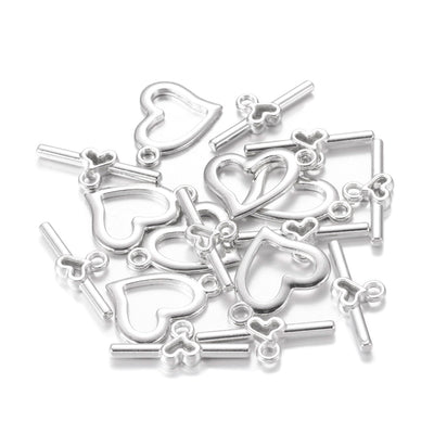 Toggle Heart Clasp for DIY Jewelry Making. Silver Color, Heart Shaped Clasps.  Size: Heart: 15x19mm, Bar: 22x9mm, Hole: 1.8mm, 5 set/package  Material: Alloy Toggle Clasps, Cadmium and Lead Free.   Usage: These Clasp are used to finish of necklaces or bracelets.