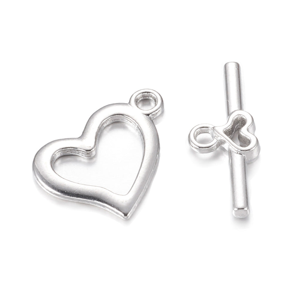 Toggle Heart Clasp for DIY Jewelry Making. Silver Color, Heart Shaped Clasps.  Size: Heart: 15x19mm, Bar: 22x9mm, Hole: 1.8mm, 5 set/package  Material: Alloy Toggle Clasps, Cadmium and Lead Free.   Usage: These Clasp are used to finish of necklaces or bracelets.
