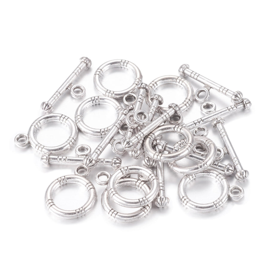 Tibetan Toggle Ring Clasp for DIY Jewelry Making. Antique Silver Color, Round Clasps.  Size: Ring: 15x12mm, Bar: 18.5x3.5mm, Hole: 2mm, 5 set/package.  Material: Alloy Toggle Clasps, Cadmium, Nickel and Lead Free, Antique Silver Color Clasp.   Usage: These Clasp are used to finish of necklaces or bracelets.