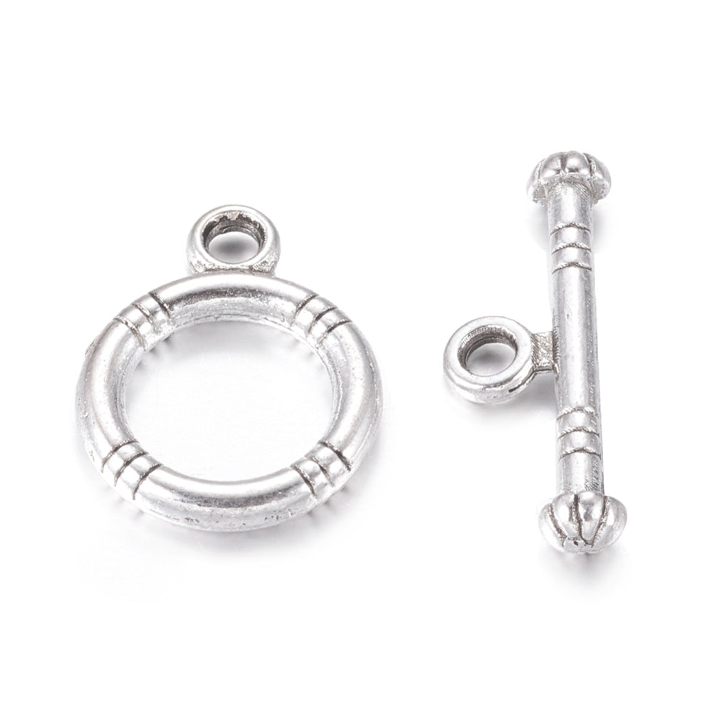 Tibetan Toggle Ring Clasp for DIY Jewelry Making. Antique Silver Color, Round Clasps.  Size: Ring: 15x12mm, Bar: 18.5x3.5mm, Hole: 2mm, 5 set/package.  Material: Alloy Toggle Clasps, Cadmium, Nickel and Lead Free, Antique Silver Color Clasp.   Usage: These Clasp are used to finish of necklaces or bracelets.