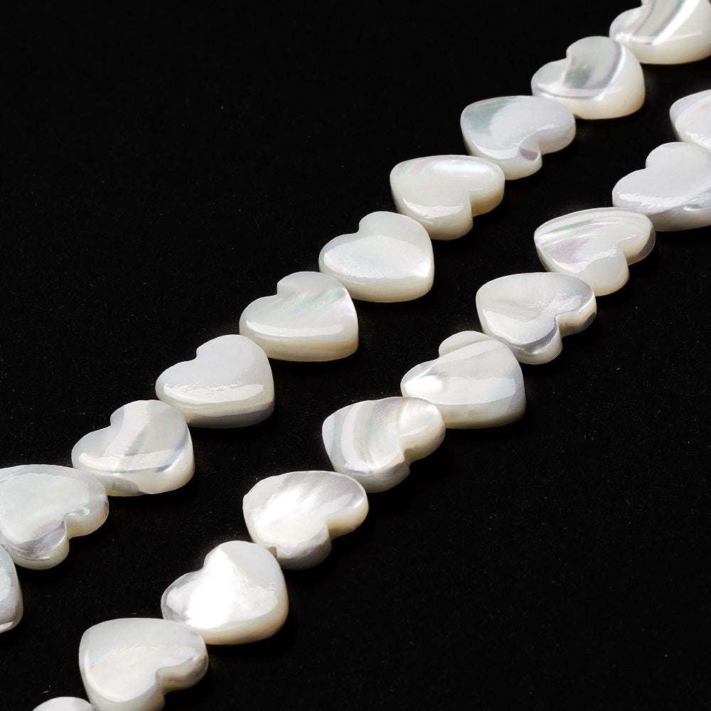 Trochus Shell Beads, Heart Shape, Seashell White Color. Trochid Shell Beads for Jewelry Making.   Size: 10mm Long, 10 Wide, 2.5-3mm Thick, Hole: 1mm; approx. 34-40pcs/strand, 15" inches long.  Material: The Beads are Natural Trochid/Trochus Shell Beads, Heart Shaped, Seashell White Color.