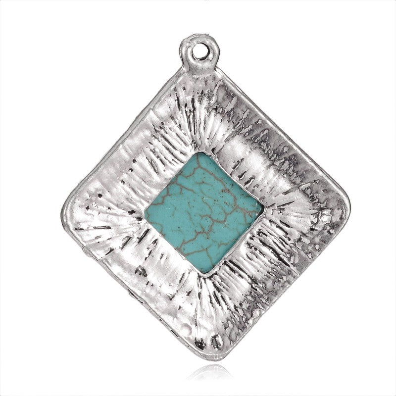 Antique Silver Plated Turquoise Gemstone Pendants, Turquoise Color. Semi-precious Gemstone Pendant for DIY Jewelry Making. Gorgeous Centre piece for Necklaces.   Size: 45mm Length, 41mm Wide, 8.5mm Thick, Hole: 2mm, 1pcs/package.   Material: Synthetic Turquoise Stone Pendant, Antique Silver Plated Alloy Pendant. High Quality, Rhombus Stone Pendants. Shinny, Polished Finish. 