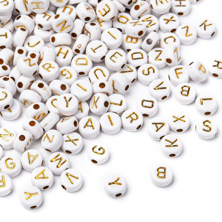 Acrylic Alphabet Spacer Beads, Gold Letters on a White base. Initial Spacers for DIY Jewelry Making Projects. Gold Plated Letter Shaped Spacers for Beading Projects.  Size: 7mm Diameter,  4mm Thick, Hole: 1.8mm, approx. 350pcs/package.   Material: Acrylic Initial Spacer Beads. Flat Round Shape, White and Gold Color Alphabet Beads. White Flat Round Beads with Gold Plated Letters.