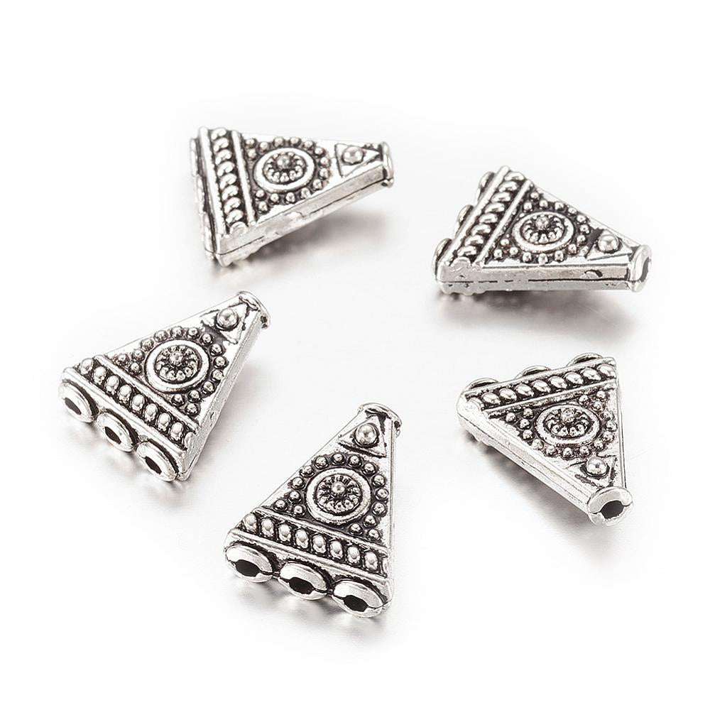 4-Hole Triangle Shape Alloy Focal Beads, Metal Spacer Beads, Triangle Beads with a Design, Antique Silver Color.  Size: 17mm Length, 14mm Width, 6mm Thick,  Hole: 1.6mm, Quantity: 5pcs/package.  Material: Alloy (Lead, Cadmium and Nickel Free) Antique Silver Color, Triangle with Pattern.