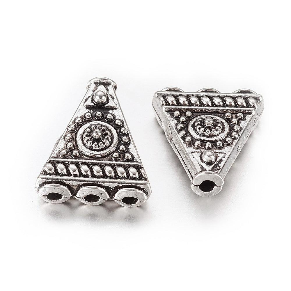 4-Hole Triangle Shape Alloy Focal Beads, Metal Spacer Beads, Triangle Beads with a Design, Antique Silver Color.  Size: 17mm Length, 14mm Width, 6mm Thick,  Hole: 1.6mm, Quantity: 5pcs/package.  Material: Alloy (Lead, Cadmium and Nickel Free) Antique Silver Color, Triangle with Pattern.