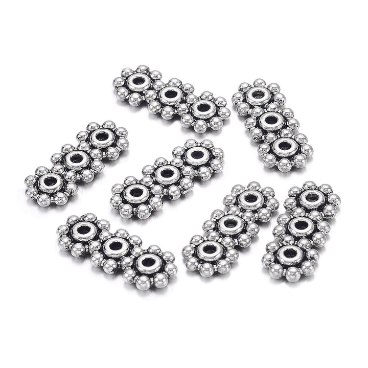 Tibetan Spacer Bars, Flower Shape, Antique Silver Color. Silver Spacer Bars for DIY Jewelry Making Projects.   Size: 15mm Length, 6mm Width, 1.5mm Thick, Hole: 1mm, approx. 12pcs/bag.   Material:  Antique Silver Tibetan Style Alloy Spacer Bar, Shinny Finish. Cadmium, Lead and Nickel Free Spacers.