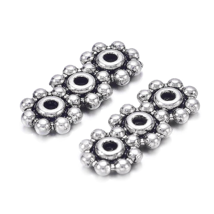 Tibetan Spacer Bars, Flower Shape, Antique Silver Color. Silver Spacer Bars for DIY Jewelry Making Projects.   Size: 15mm Length, 6mm Width, 1.5mm Thick, Hole: 1mm, approx. 12pcs/bag.   Material:  Antique Silver Tibetan Style Alloy Spacer Bar, Shinny Finish. Cadmium, Lead and Nickel Free Spacers.