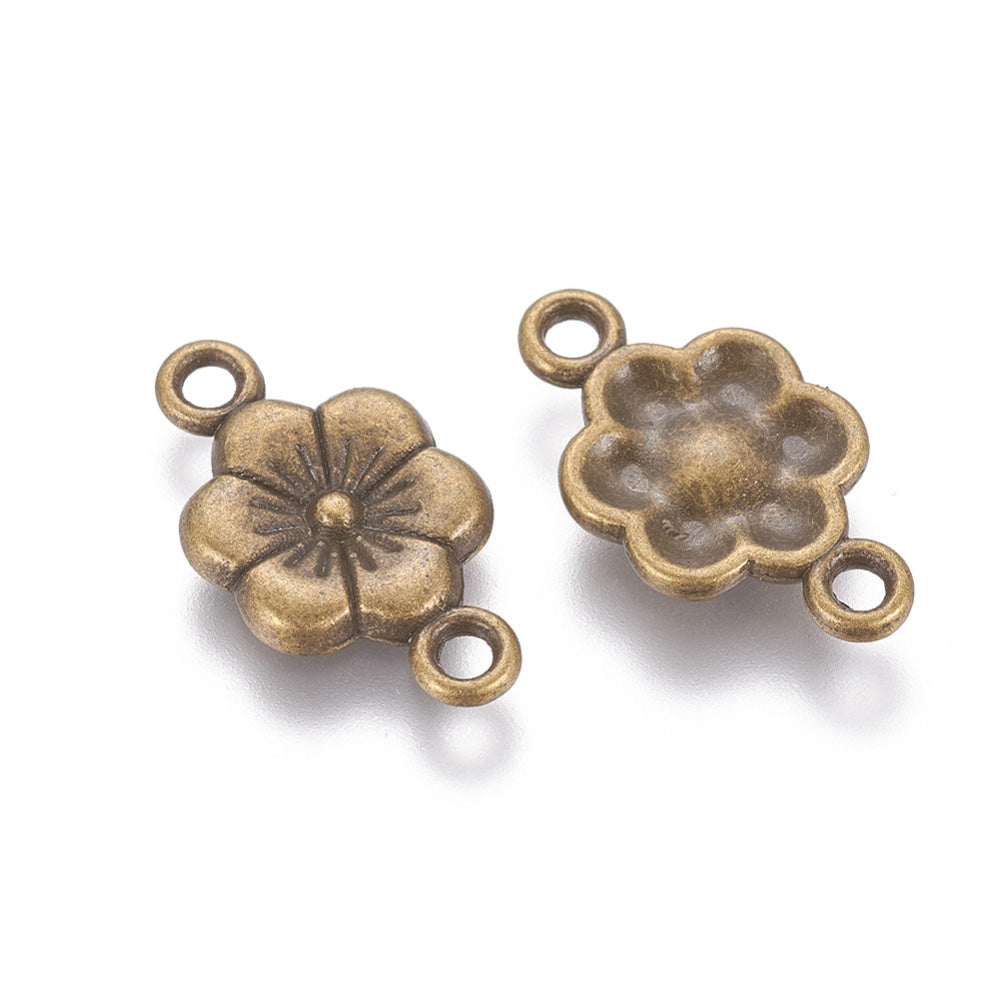Link Connectors, Plum Blossom, Flower Shape links. Antique Bronze Colored Connector for DIY Jewelry Making.   Size: 18mm Length, 10mm Width, 2mm Thick, Hole: 2mm, Quantity: 5pcs/bag.  Material: Metal Alloy Connectors, Links. Flower Shape. Antique Bronze Color. 