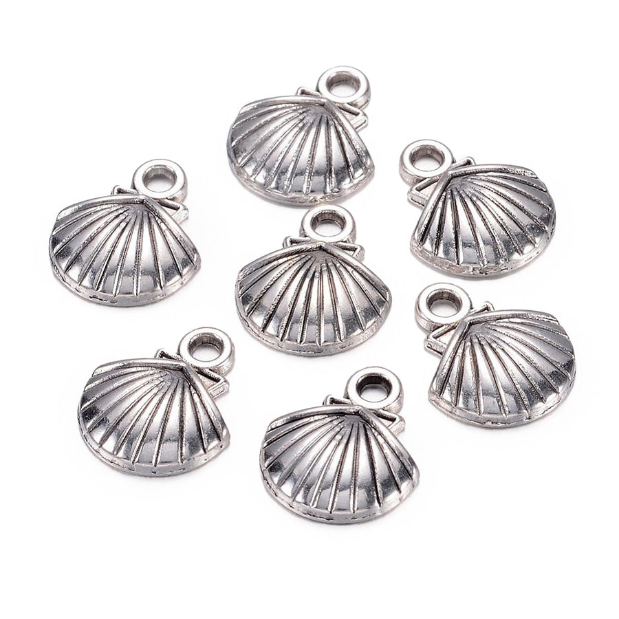 Tibetan Sea Shell Charms, Antique Silver Colored Clam Shell Charms for DIY Jewelry Making.   Size: 11mm Width, 14mm Length, 2.5mm Thick, Hole: 2mm, Quantity: 5 pcs/package.   Material: Zinc Alloy (Lead and Nickel Free) Charms. Antique Silver Color. Shinny Finish.