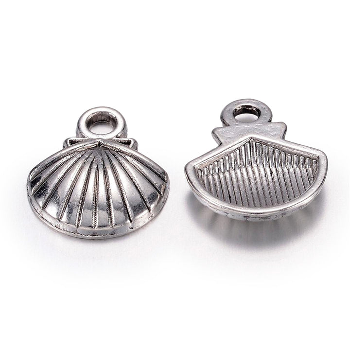 Tibetan Sea Shell Charms, Antique Silver Colored Clam Shell Charms for DIY Jewelry Making.   Size: 11mm Width, 14mm Length, 2.5mm Thick, Hole: 2mm, Quantity: 5 pcs/package.   Material: Zinc Alloy (Lead and Nickel Free) Charms. Antique Silver Color. Shinny Finish.