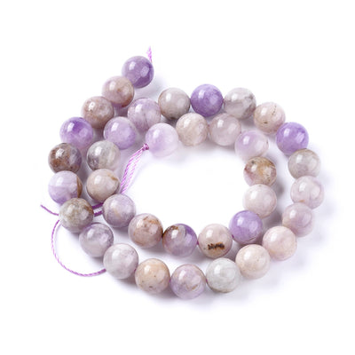 Stunning Natural Lavender Jade Beads, Round, Lavender/Lilac Color. Semi-Precious Crystal Gemstone Beads for Jewelry Making. Great for Stretch Bracelets.  Size: 8mm in Diameter, Hole: 1.1mm; approx. 47pcs/strand, 15" inches long.  Material: The Beads are Natural Lavender Jade, Lilac Color. Polished, Shinny Finish. bead lot
