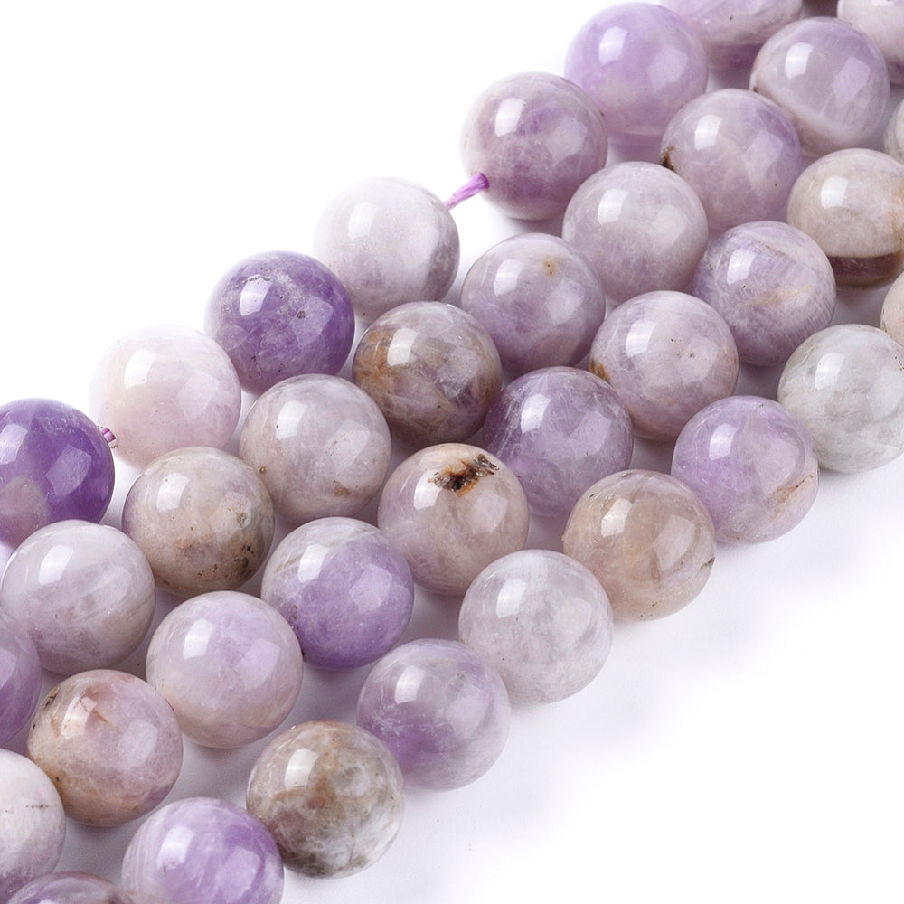 Lavender Jade Beads, Round, Lavender/Lilac Color. Semi-Precious Crystal Gemstone Beads for Jewelry Making. Great for Stretch Bracelets.  Size: 10mm in Diameter, Hole: 1.3mm; approx. 36pcs/strand, 14.5" inches long.  Material: The Beads are Natural Lavender Jade, Lilac Color. Polished, Shinny Finish.  Lavender Jade Properties: Also Known as Lilac Jade Stone. Lilac Jade is the Stone of Angels. Its Believed to Enlighten You in a Spiritual Way and Infuse You with Humility. 