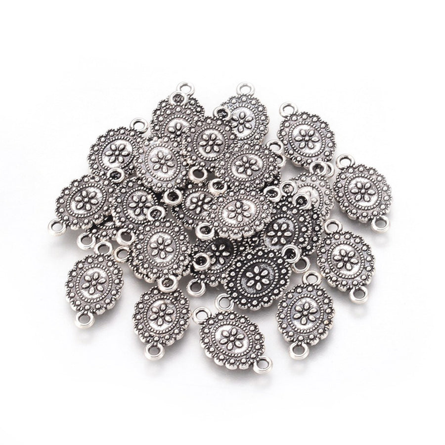 Link Connectors, Oval with Design. Antique Silver Colored Connector for DIY Jewelry Making.   Size: 18mm Length, 11mm Width, 2mm Thick, Hole: 2mm, Quantity: 5pcs/bag.  Material: Metal Alloy (Nickel, Lead and Cadmium Free) Connectors, Links. Oval Shape. Antique Silver Color. 
