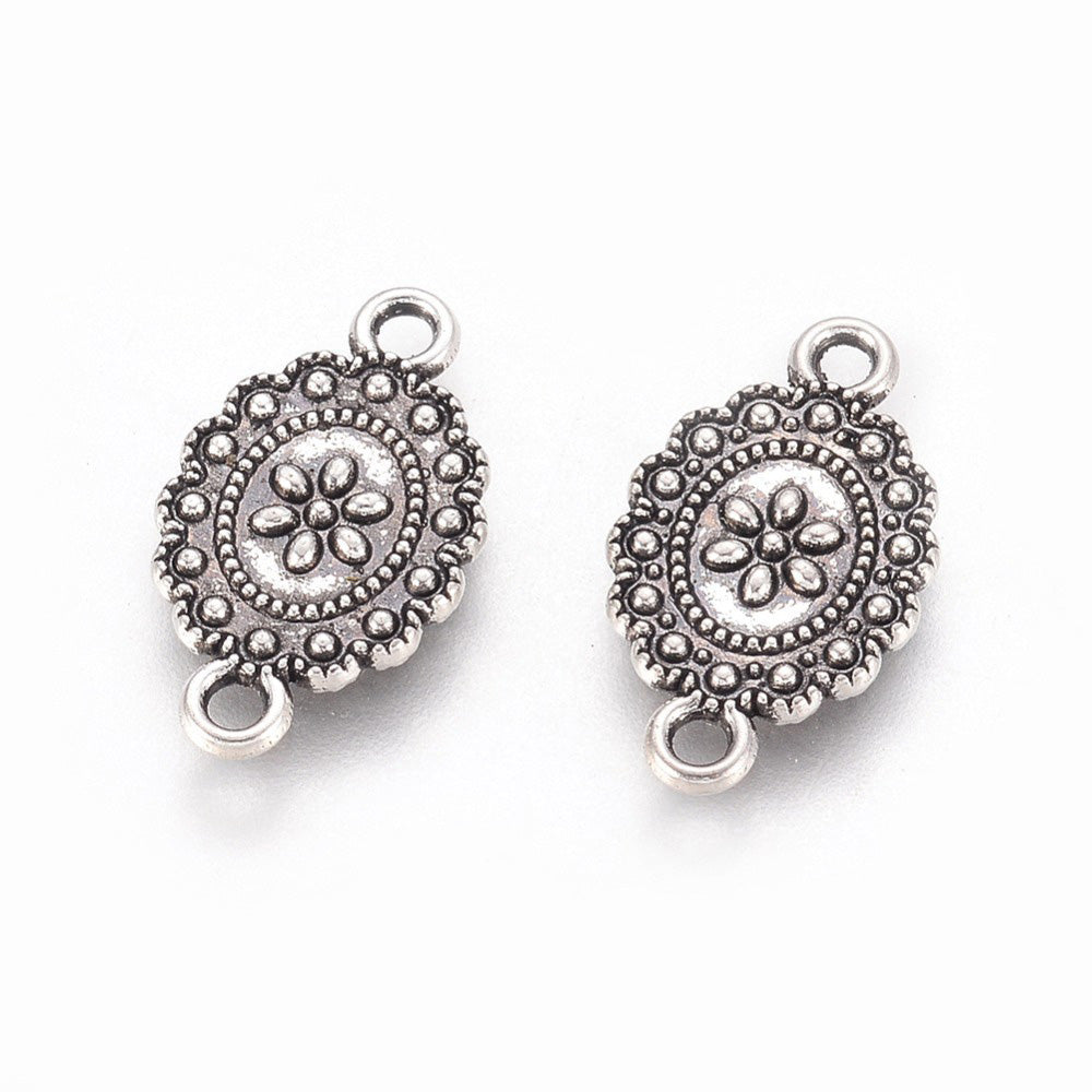 Link Connectors, Oval with Design. Antique Silver Colored Connector for DIY Jewelry Making.   Size: 18mm Length, 11mm Width, 2mm Thick, Hole: 2mm, Quantity: 5pcs/bag.  Material: Metal Alloy (Nickel, Lead and Cadmium Free) Connectors, Links. Oval Shape. Antique Silver Color. 