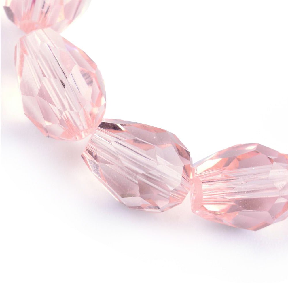 Teardrop Crystal Glass Beads, Faceted, Pale Pink Color, Glass Crystal Bead Strands. Shinny, Premium Quality Crystal Beads for Jewelry Making.  Size: 7mm Length, 5mm Thick, Hole: 1.5mm; approx. 68pcs/strand, 16" inches long.  Material: The Beads are Made from Glass. Glass Crystal Beads, Teardrop Shaped, Light Pale Pink Colored Beads. Polished, Shinny Finish.   