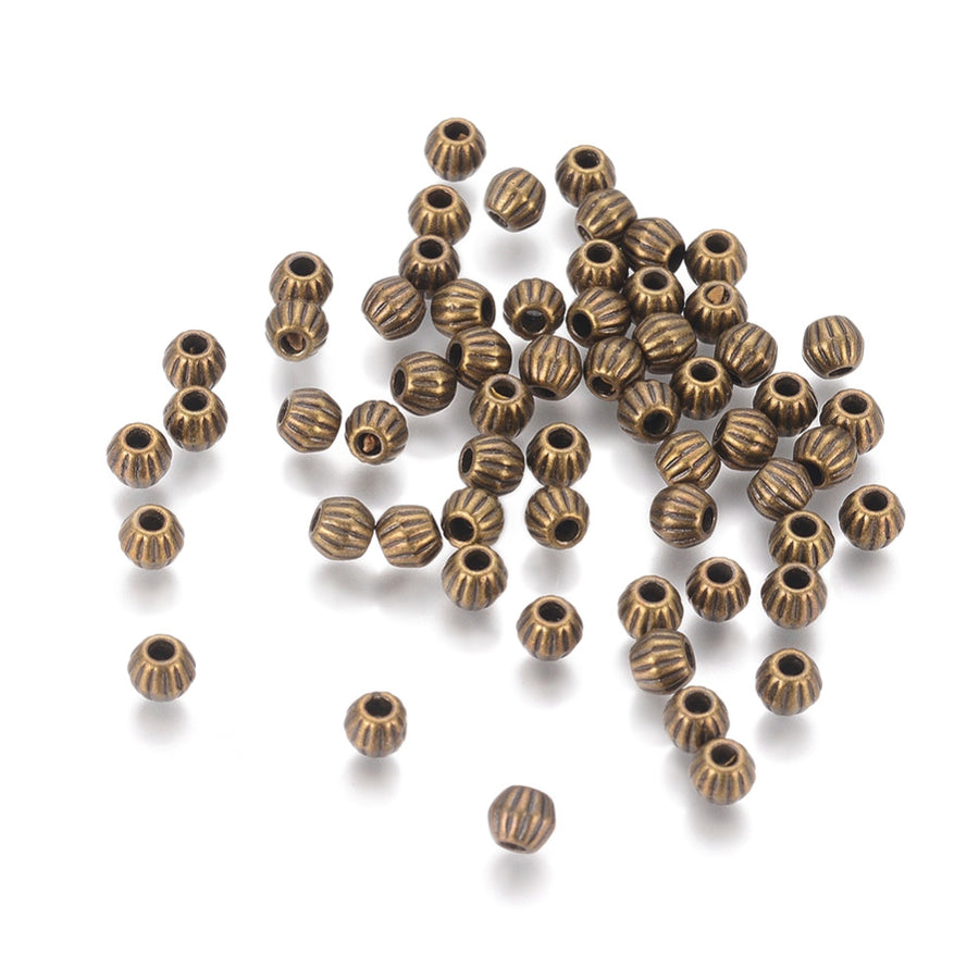 Tibetan Bicone Spacer Beads, Antique Bronze Color. Bronze Spacers for DIY Jewelry Making Projects. High Quality, Classy, Non-Tarnish Spacers for Beading Projects.  Size: 4.5mm Wide, 4mm Length, Hole: 1mm, approx. 25pcs/bag.   Material:  Antique Bronze Tibetan Style, Shinny Finish. Cadmium, Lead and Nickel Free Spacers.